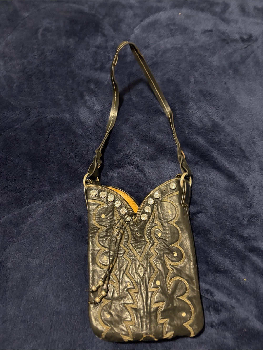 Embellished Black Leather Crossbody Bag with Intricate Embossing